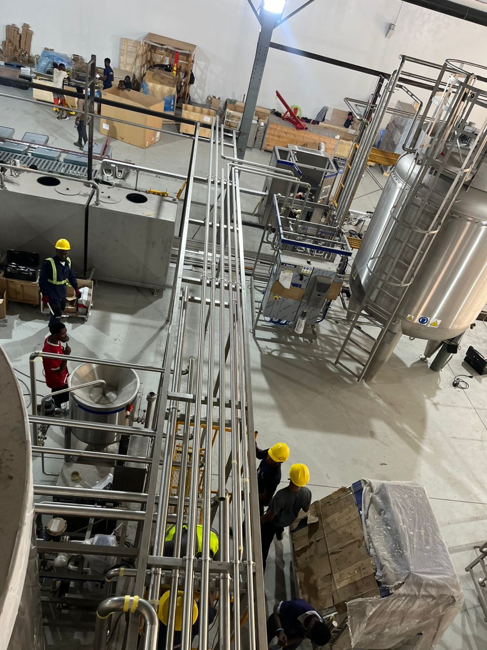 Industrial process plant installation with stainless tanks and pipework