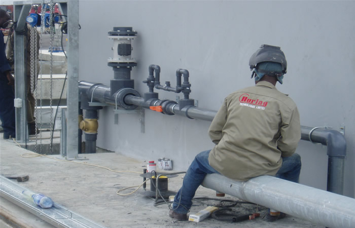Hurlag technician installing external service pipework